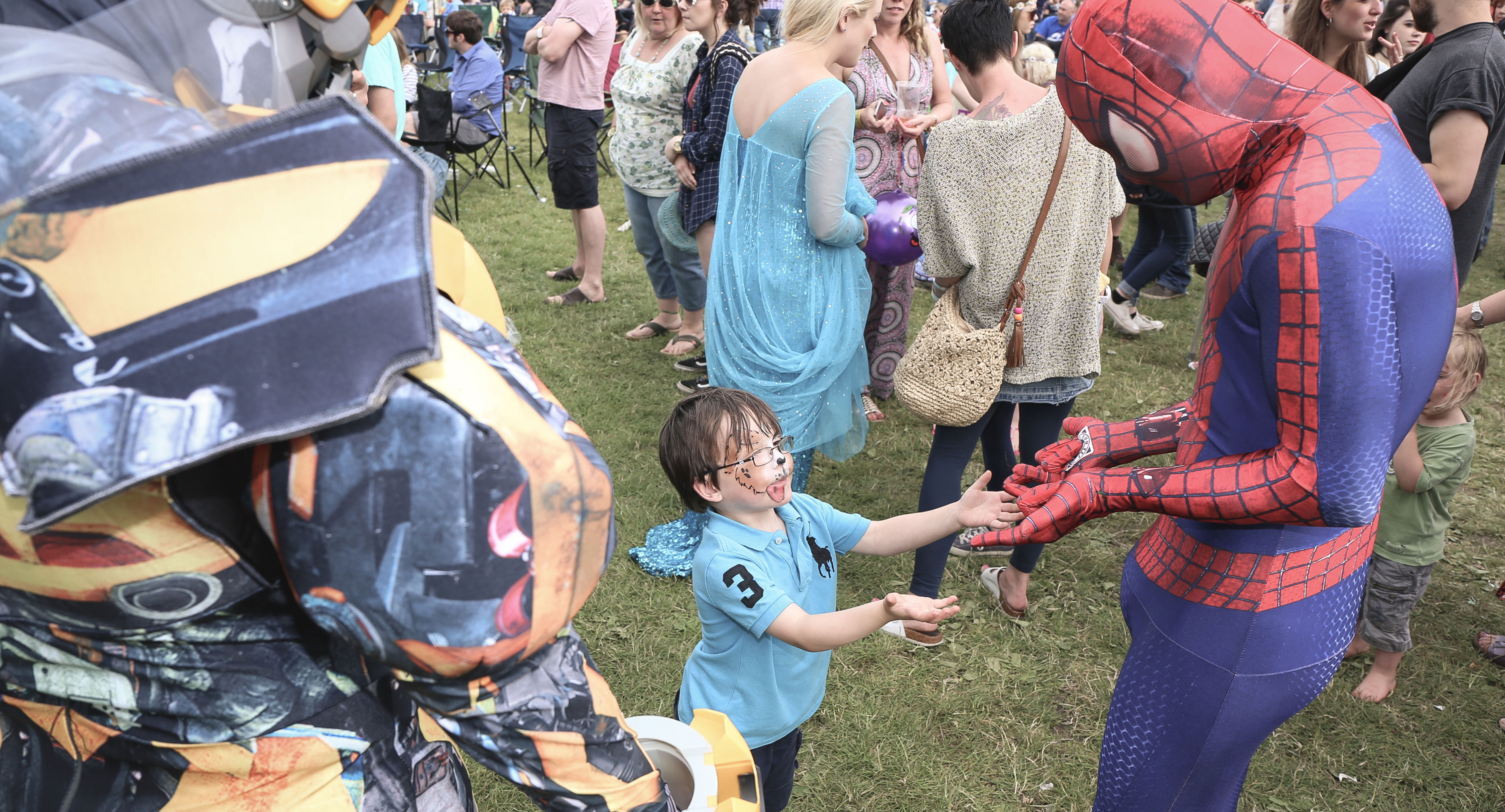 Child meeting superheroes at Corbridge Festival